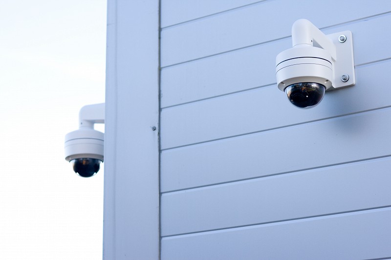 CCTV cameras on aluminium-sided building